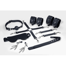 Набір Feral Feelings BDSM Kit 7 Black, наручники, поножі, конектор, маска, падл, кляп, затискачі